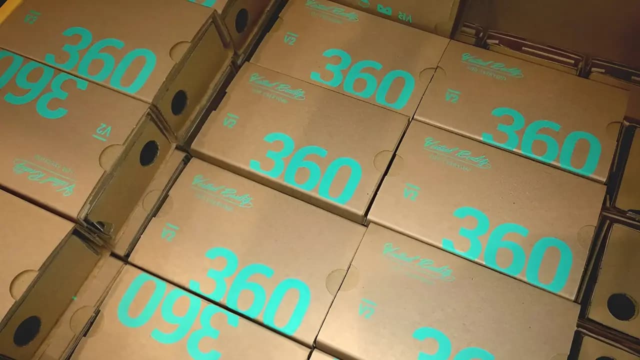 A large stack of cardboard boxes labeled 360 with virtual reality branding.